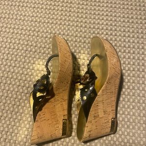 Gold and black wedge sandals